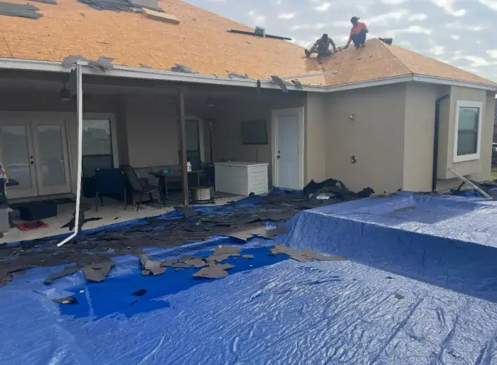 Decks and roofing project with workers on a residential roof