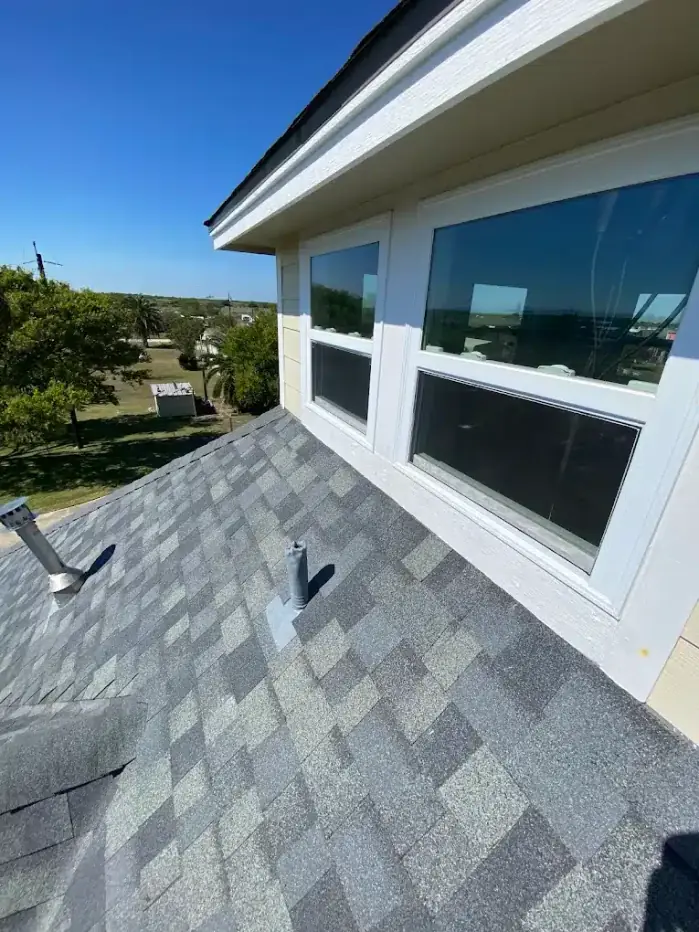 New gray shingle roof and exterior home renovation in Texas
