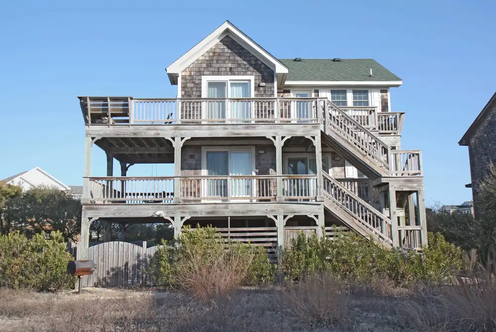 Raised beach house with wraparound decks on two levels